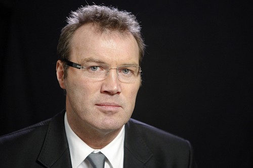 Author Andrew Morton poses during an interview with Reuters in New York